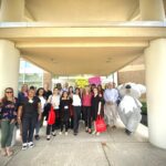 Large group of people outside the Medical Center at Woods