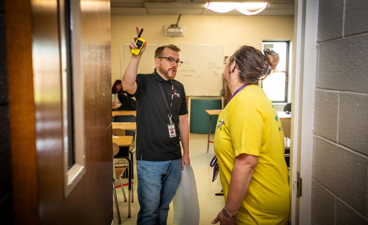 mean holding door open while a woman looks at him