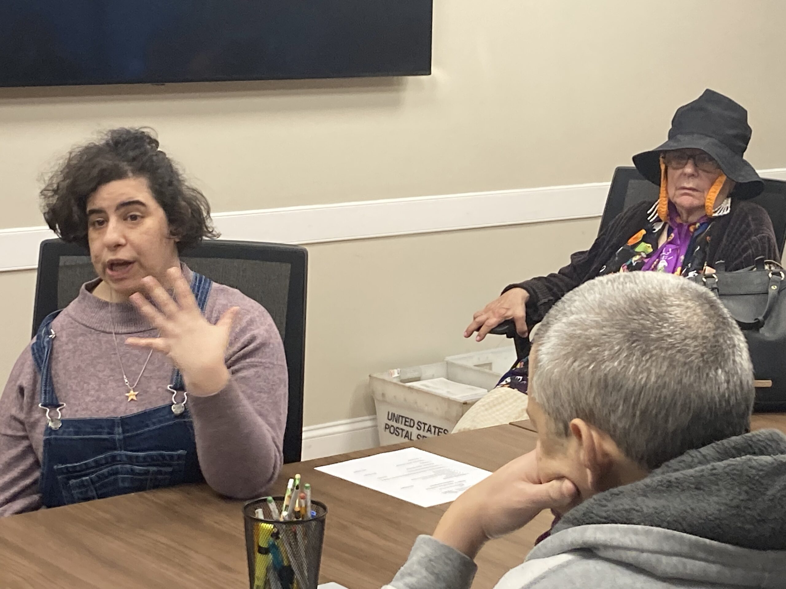 People around a table discussing health equity